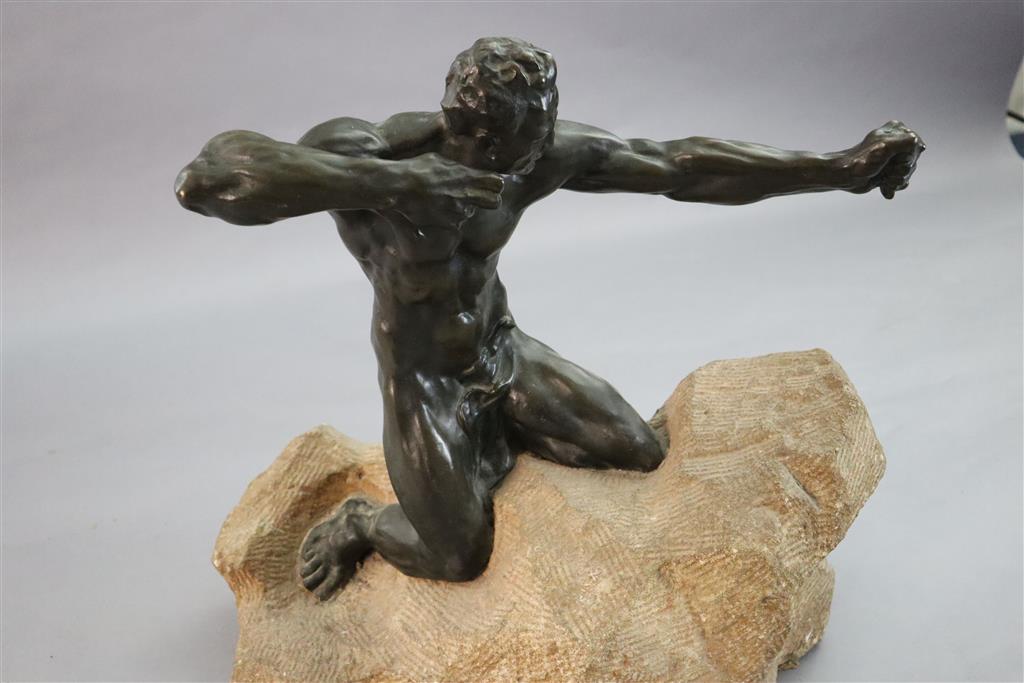 Alfredo Pina (1883-1966). A bronze figure of Héraclès kneeling upon a rocky mound, width 21in. height 20in.